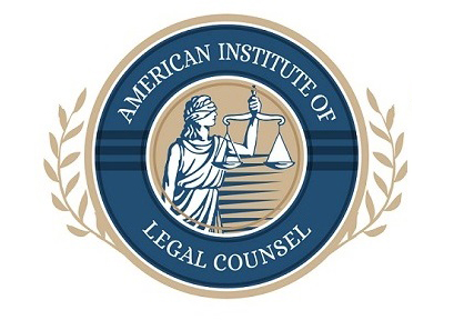 American Institute of Legal Counsel circular logo featuring Lady Justice holding scales, surrounded by a blue border