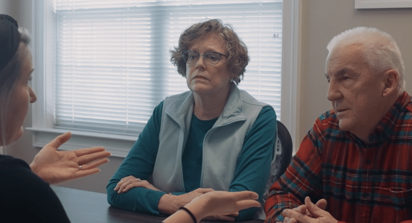 Middle-Aged-Couple-Talk-to-Paralegal