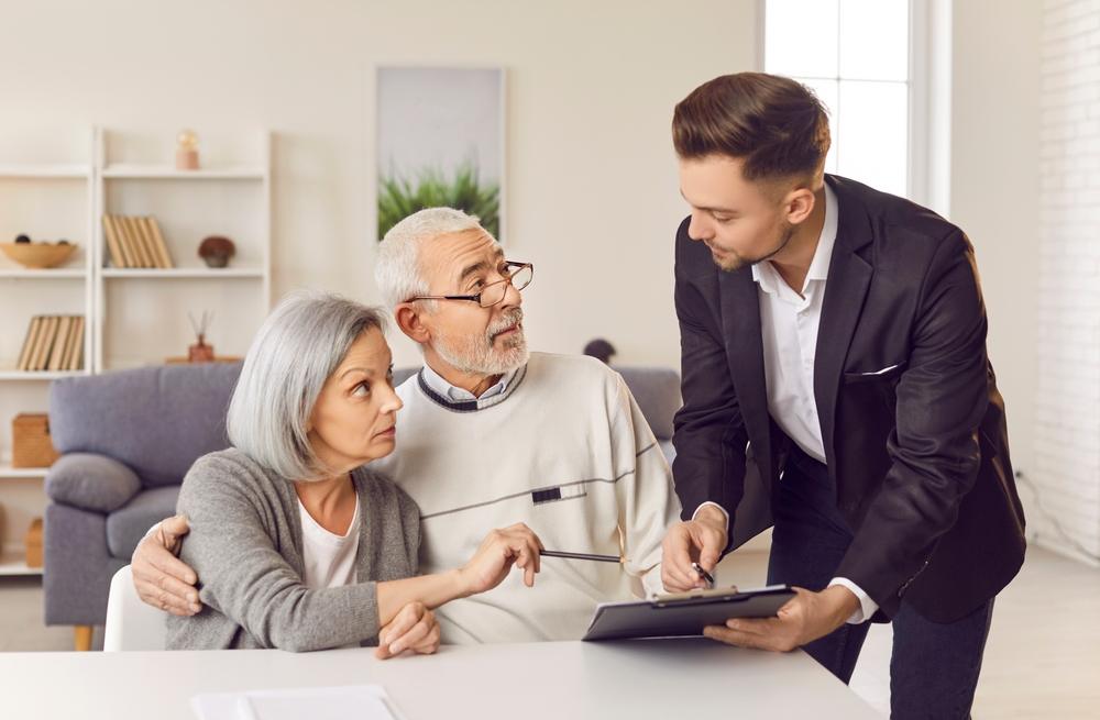 An elder law attorney meets with an older couple and explains what a durable power of attorney is.