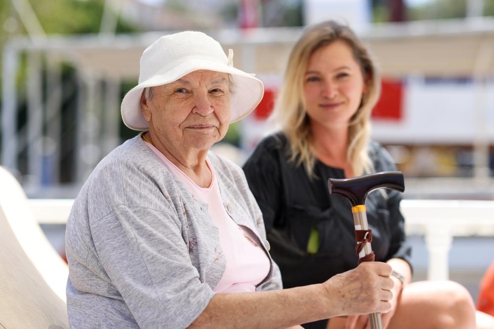 A woman with her caregiver, who wonders what the responsibilities of a court-appointed guardian are.