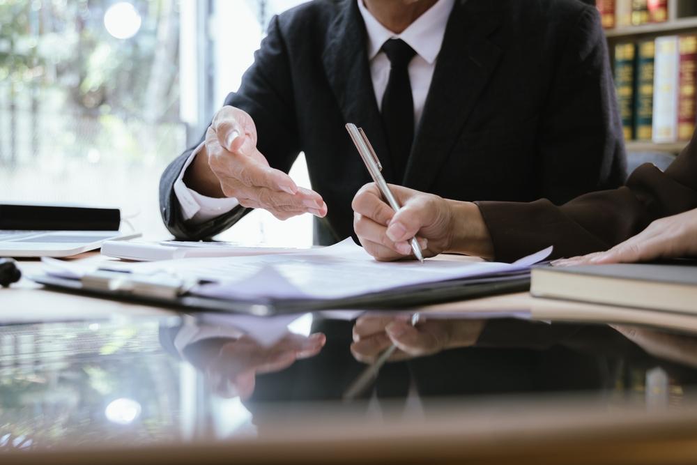 A lawyer assists a client and explains what probate administration is in Georgia.