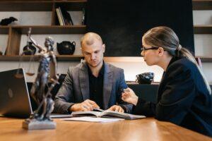A lawyer meets with a client to discuss how long probate takes in Georgia.